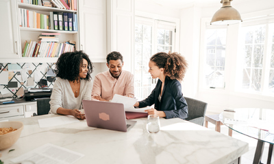 Couple planning their selling process with their Realtor®