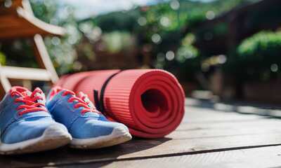 Running Shoes and Yoga Mat