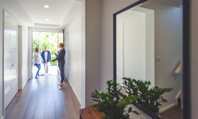 Realtor Showing Young Couple a House