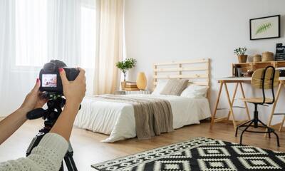 Photographer with Bed in Frame